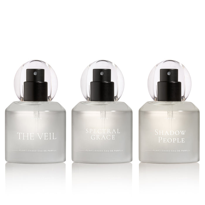 Three perfume bottles labeled 'The Veil', 'Spectral Grace', and 'Shadow People' on a white background.