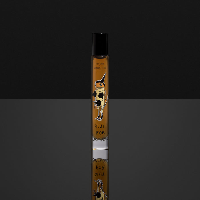 rollerball perfume with Slut For October graphic on a black background